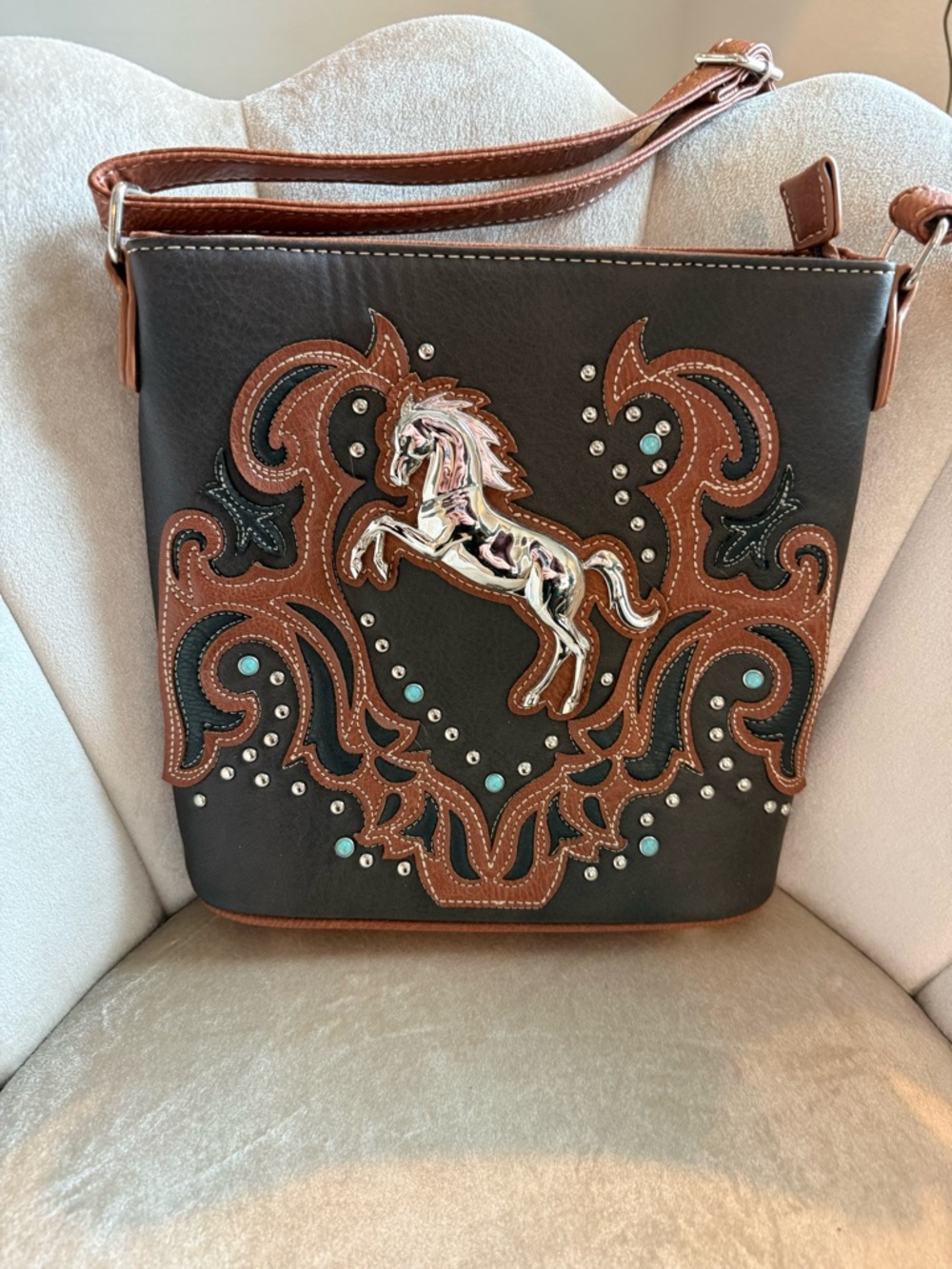 Women's Black Shoulder Bag with Brown Trim and Horse Accent